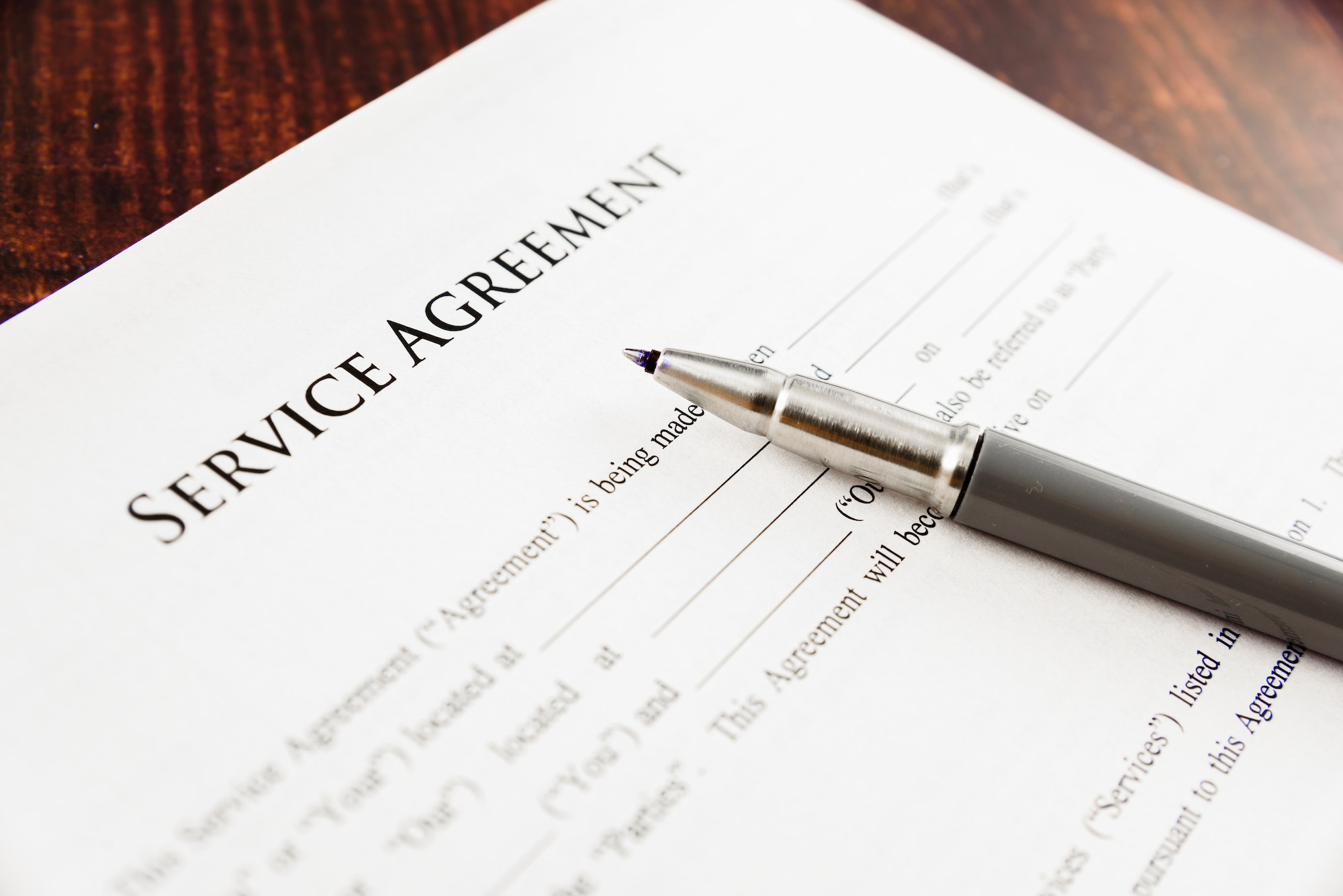 Concept Image of a Service agreement written by a lawyer.