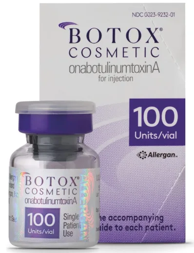 The Allergan BOTOX 100 Unit Vial is displayed on the left and front of the packaging, with a white label and a purplish box on the bottom left that states "100 units/vial". The label features the words "BOTOX cosmetic" in all caps, followed by "onabotulinumtoxinA" in lowercase underneath. On the bottom right, it states "Single Patient Use". The packaging has a NDC number listed on the top right, with the words "BOTOX" and "COSMETIC" in all caps below the number and centered. Below "cosmetic", it states again "onabotulinumtoxinA for injection" in all lowercase. On the mid-right side of the box, in purple, it states "100 units/vial". Directly below the purple box, is the Allergan logo and the word "Allergan" written on the right of the logo. The packaging is in white and purple, with a sleek and professional design that conveys a sense of quality and trust | AS3 Med Spa